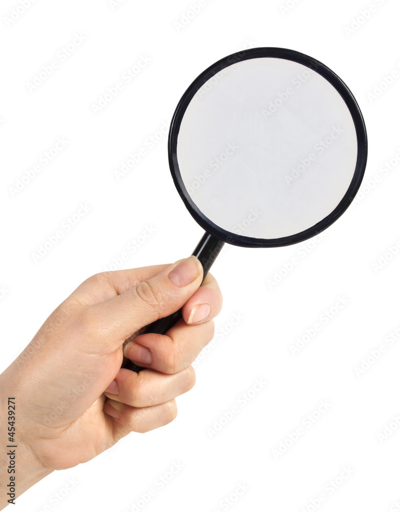 Magnifying glass in hand isolated on white background Magnifying glass in hand isolated on white background