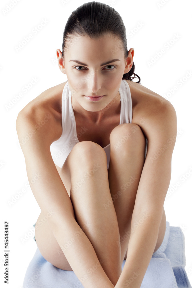 Fototapeta premium young woman hugging knees