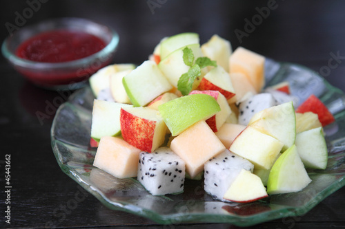 fruit salad on wood background