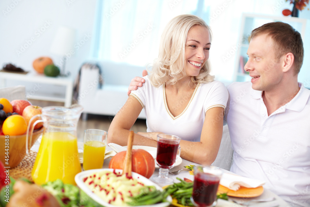 Couple by festive table Couple by festive table