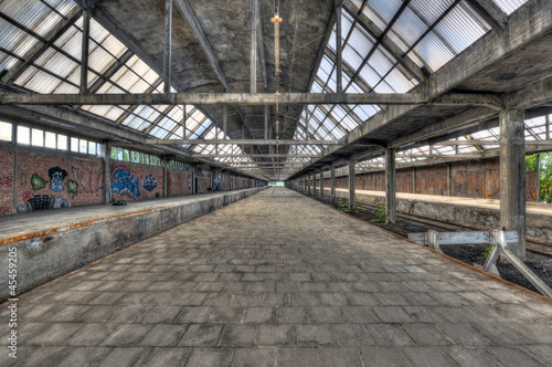 Abandoned platform at a derelict railway station