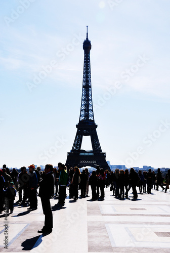 Silhouette of Eiffel tower and a crowd of tourists
