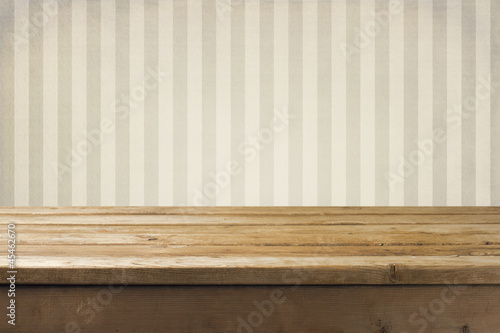 Vintage striped pattern wall and wooden deck tabletop