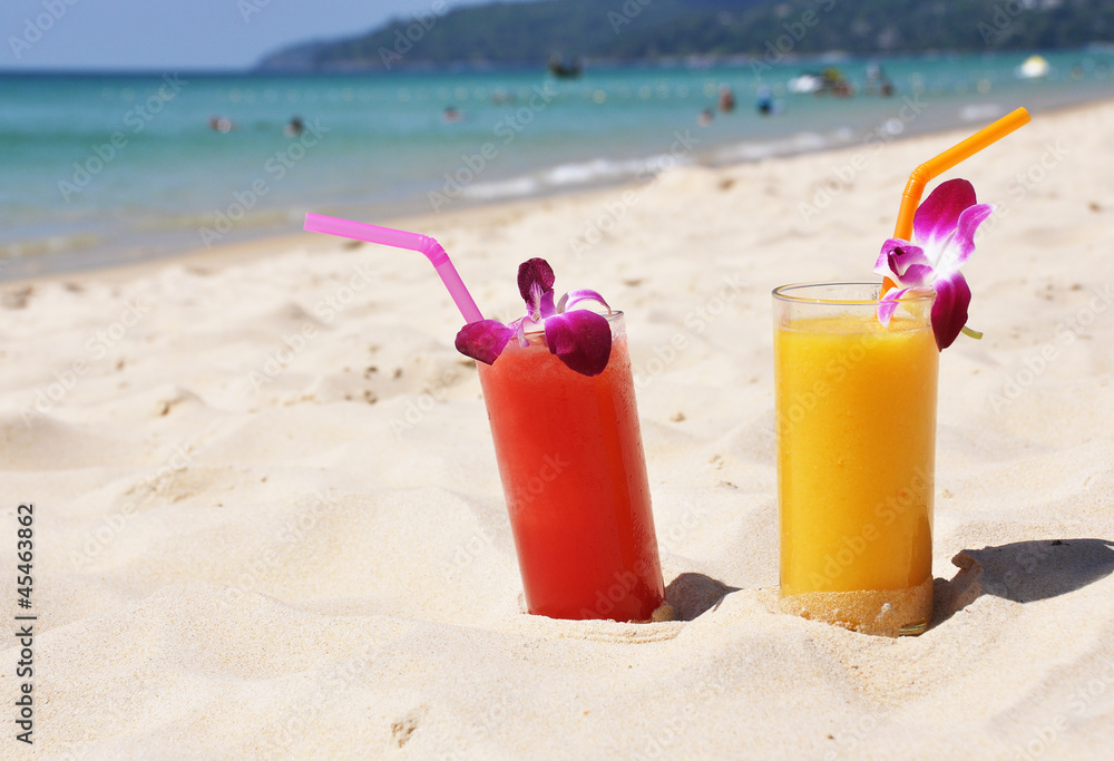 Pair of fruit shakes on the tropical beach Pair of fruit shakes on the tropical beach