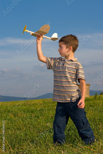 Boy playing with model airplane © Krzysztof Nogawczyk