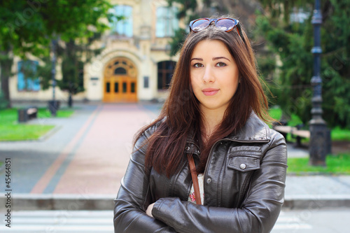 Pretty brunette girl in front of Institute in Kiev, Ukraine