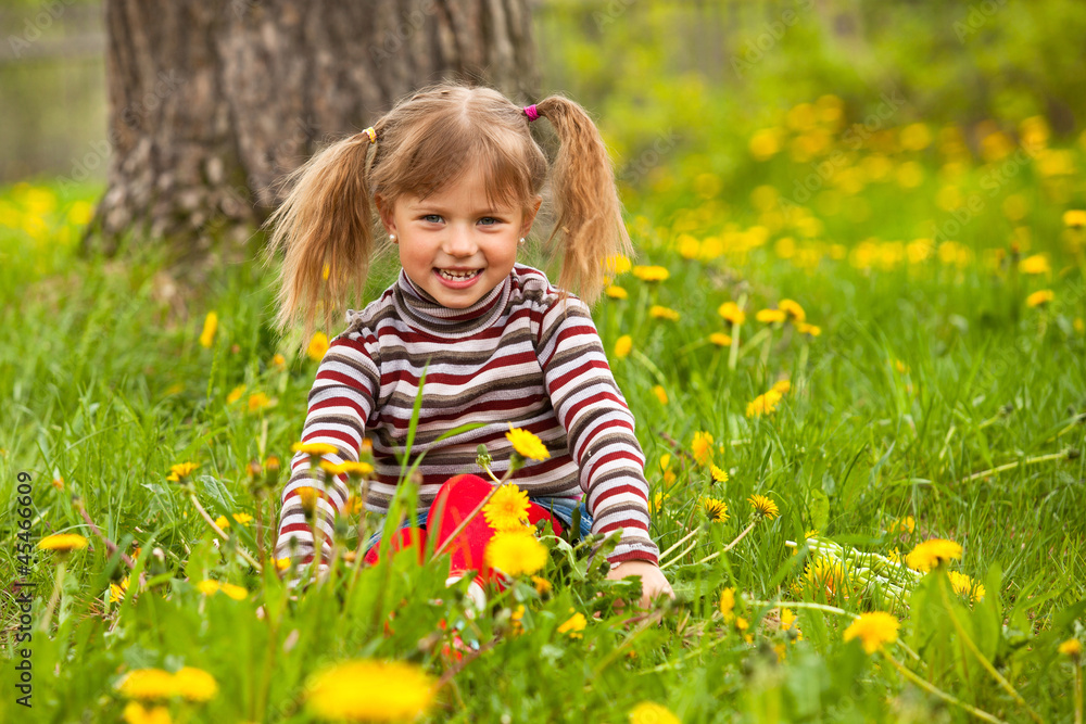 Funny lovely little five-year girl in park Funny lovely little five-year girl in park