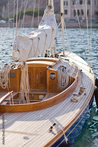 beautiful wooden sailboat on blue sea ocean © Anastasiia Krivenok