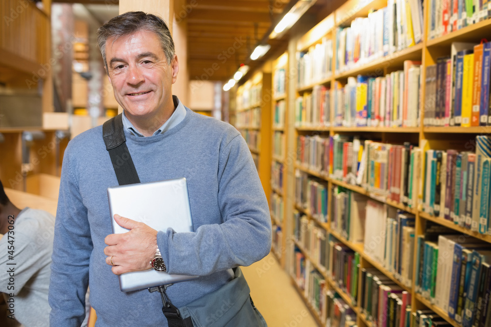 Man holding a book to his chest