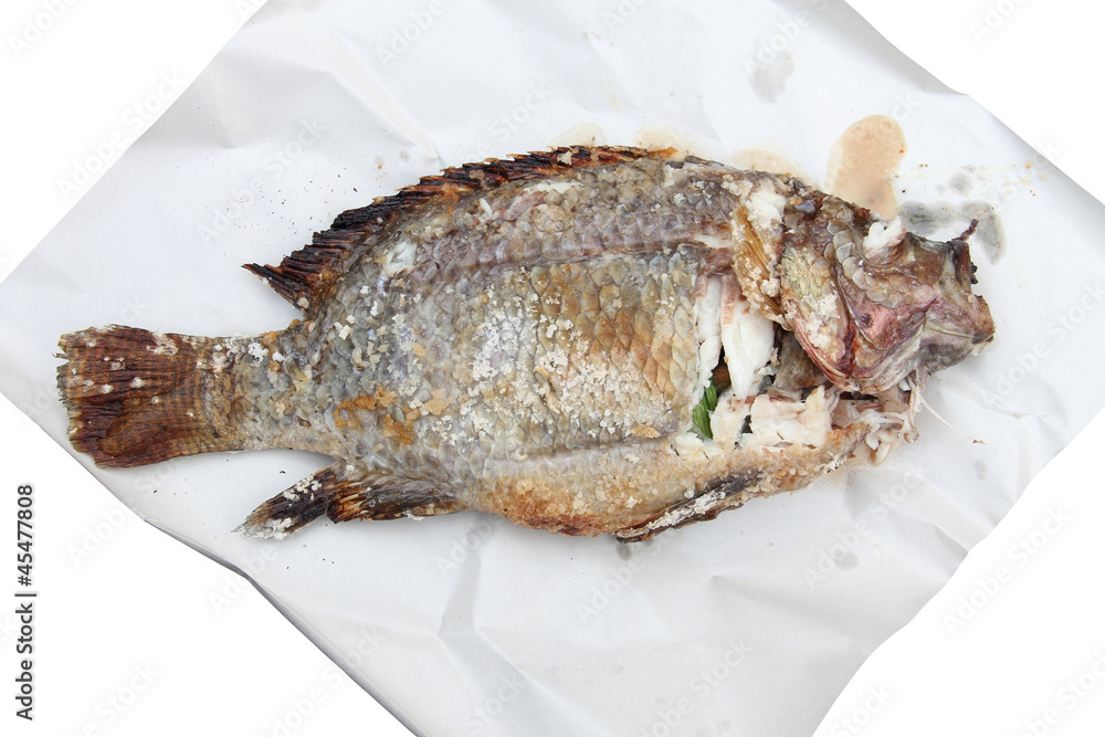 Grilled Foods - Grilled fish over the white paper Grilled Foods - Grilled fish over the white paper