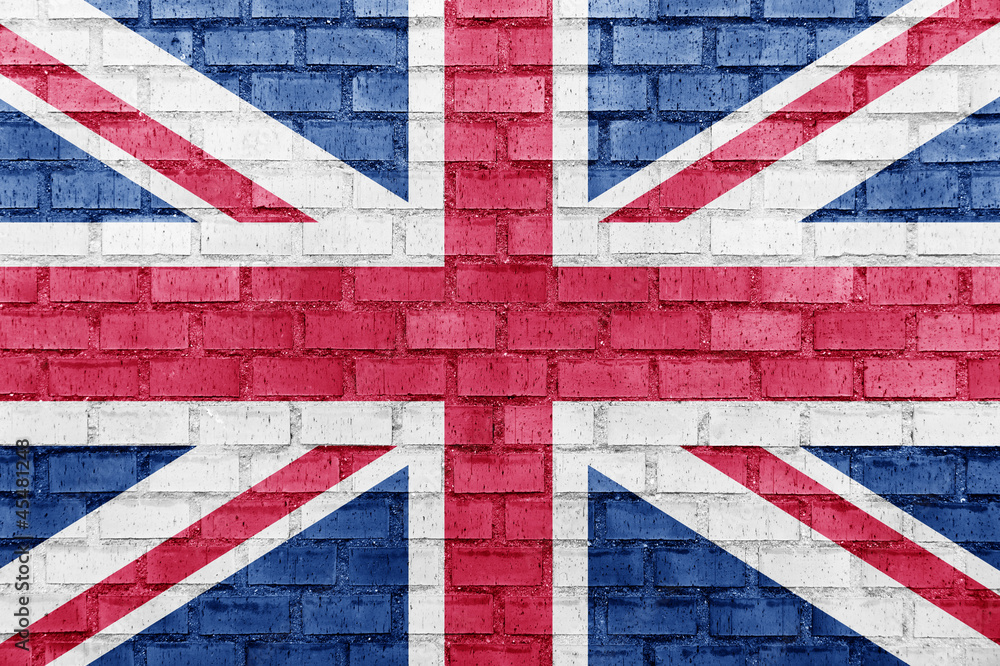 Fototapeta premium United Kingdom (UK) flag on a brick wall