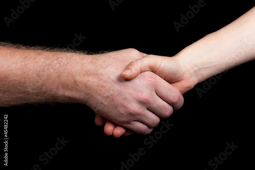 Hand shake between a man and woman