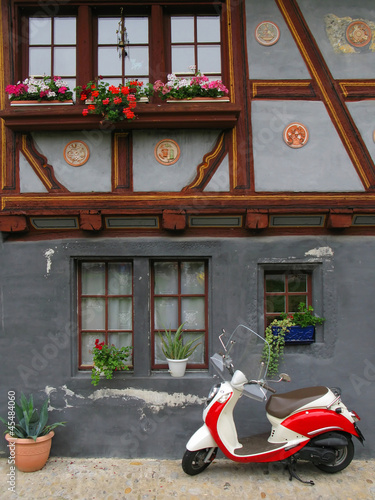 Trendy moped against old building. Fribourg  Switzerland