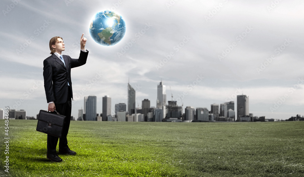 Businessman holding the world Businessman holding the world