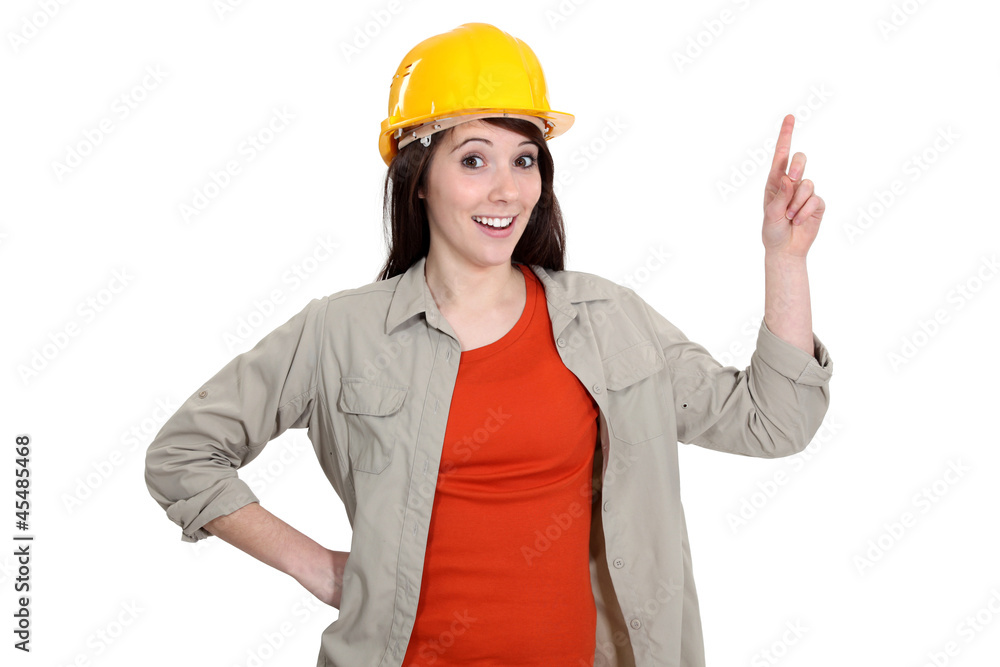 Female construction worker holding up her finger