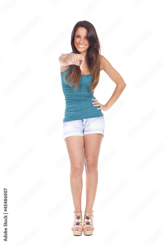 Fototapeta premium Beautiful young woman pointing and smiling