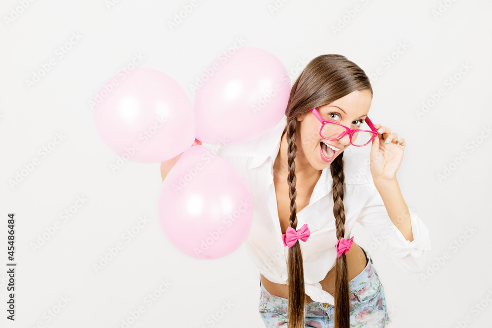 Happy young woman with pink baloons celebrating birthday Happy young woman with pink baloons celebrating birthday