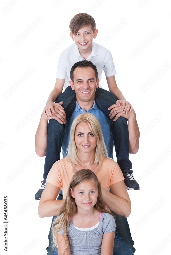 Portrait Of Family With Son On Father's Shoulder