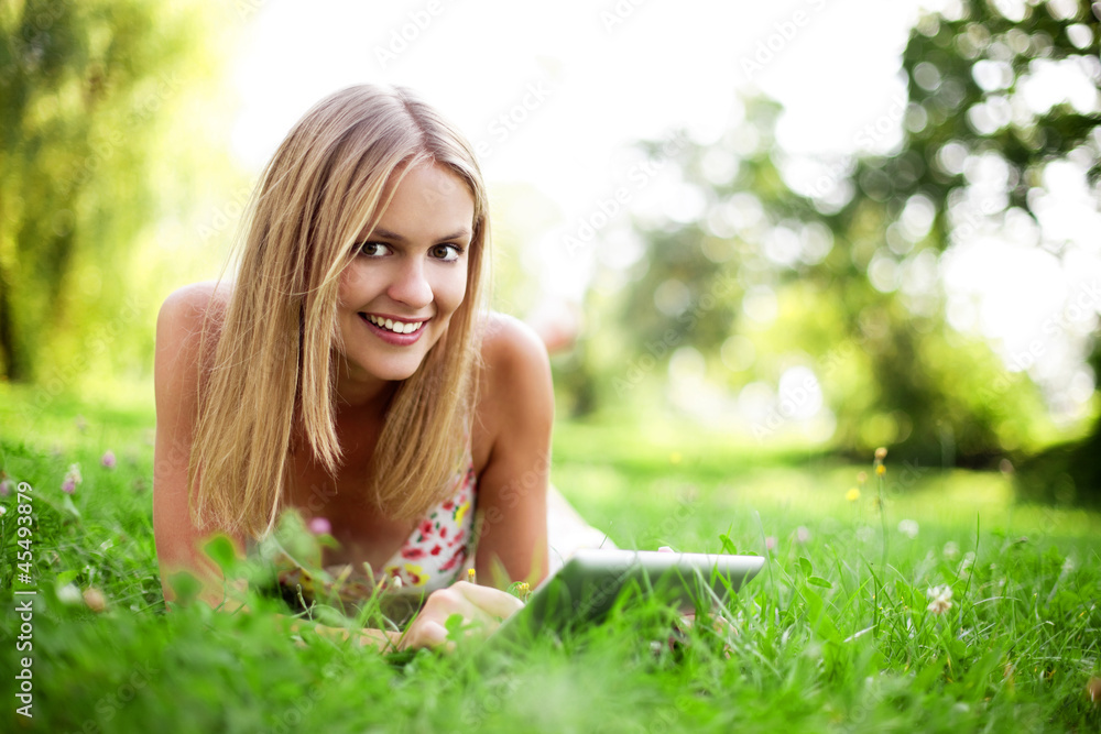 Young woman using tablet outdoor Young woman using tablet outdoor