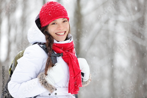 Woman winter hiking in snow