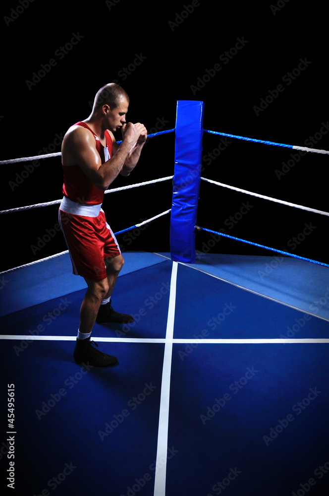 Male boxer in ring doing exercise Male boxer in ring doing exercise