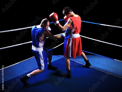 Two male boxers fighting in ring © cirkoglu