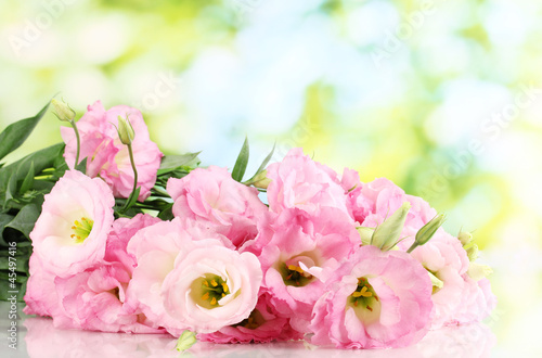 bouquet of eustoma flowers  on green background