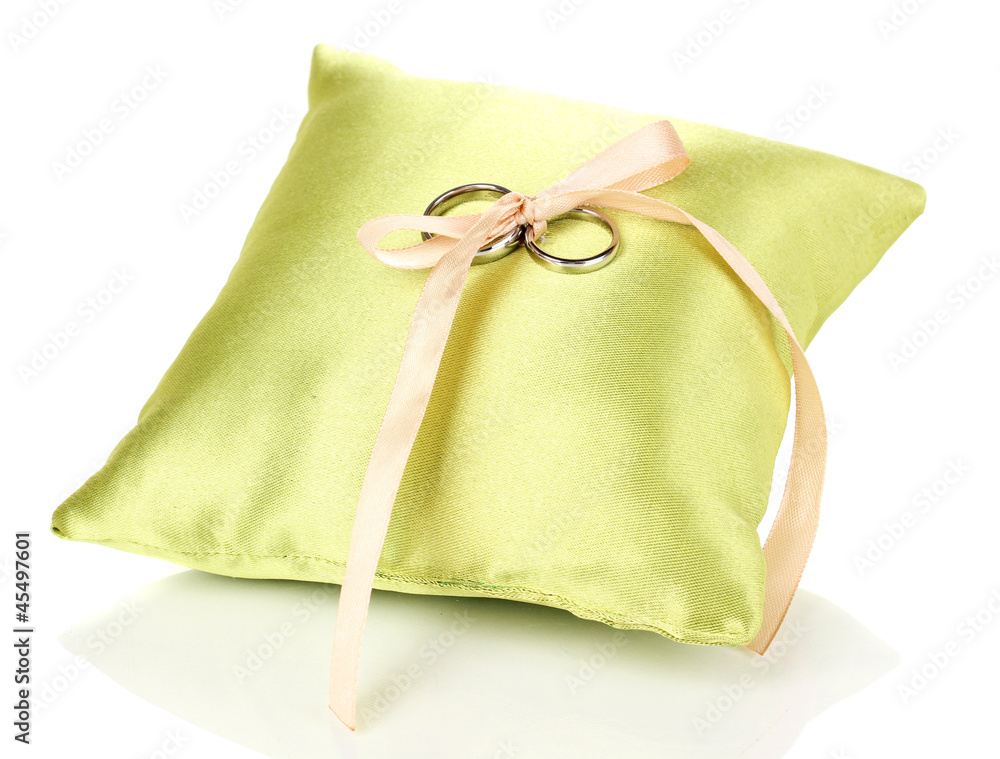 Wedding rings on satin pillow isolated on white Wedding rings on satin pillow isolated on white