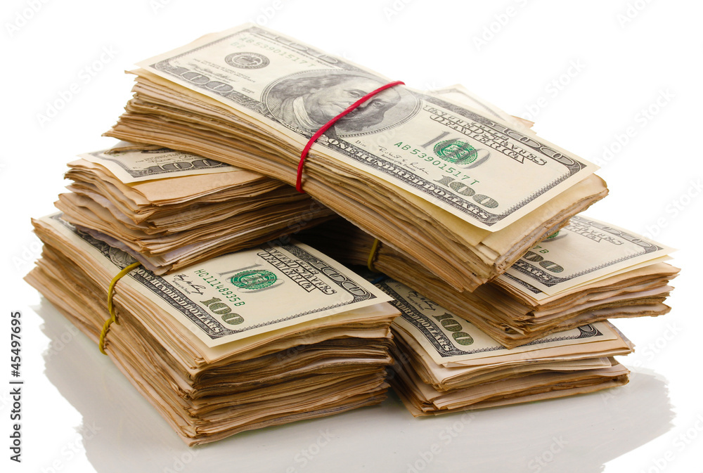 Stacks of one hundred dollars banknotes close-up isolated Stacks of one hundred dollars banknotes close-up isolated