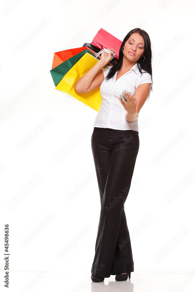 portrait cute young woman mobile phone while holding shopping ba portrait cute young woman mobile phone while holding shopping ba