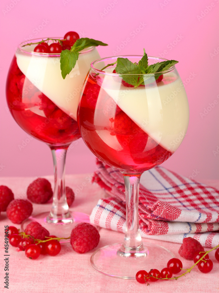 fruit jelly with berries in glasses on pink background fruit jelly with berries in glasses on pink background
