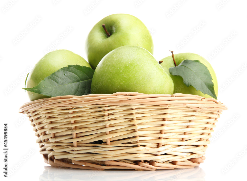 Ripe green apples with leaves in basket isolated on white Ripe green apples with leaves in basket isolated on white