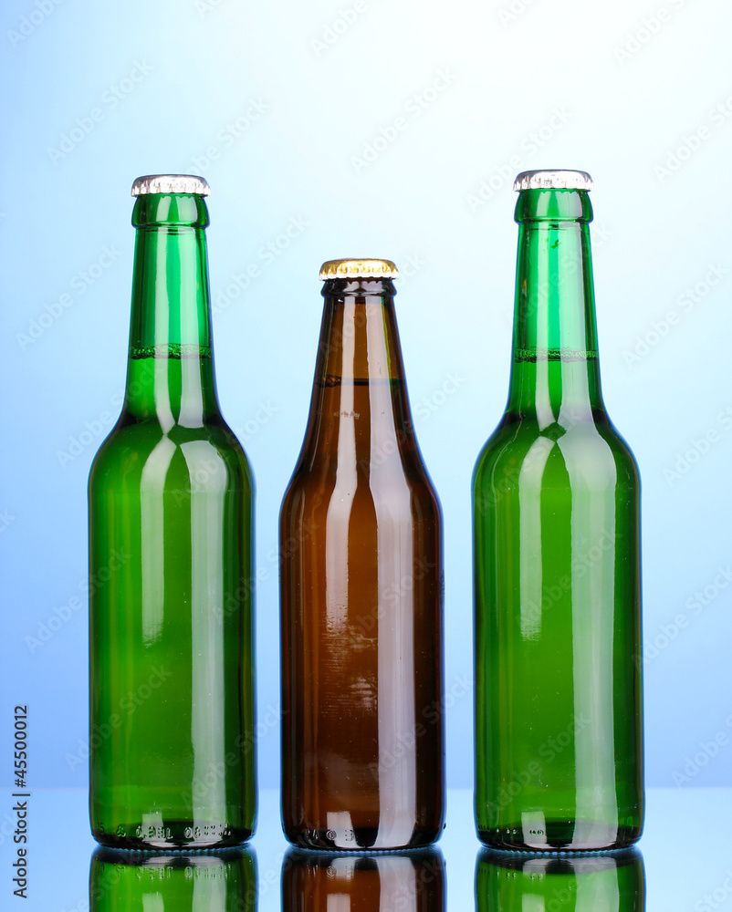 bottles of beer on blue background bottles of beer on blue background
