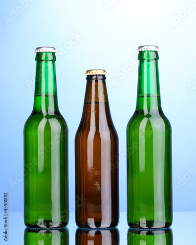 bottles of beer on blue background
