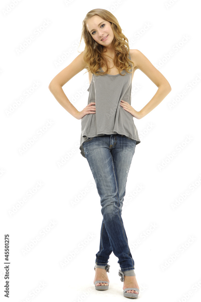 young fashion model in blue jeans posing young fashion model in blue jeans posing