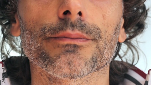 unshaven man smoking