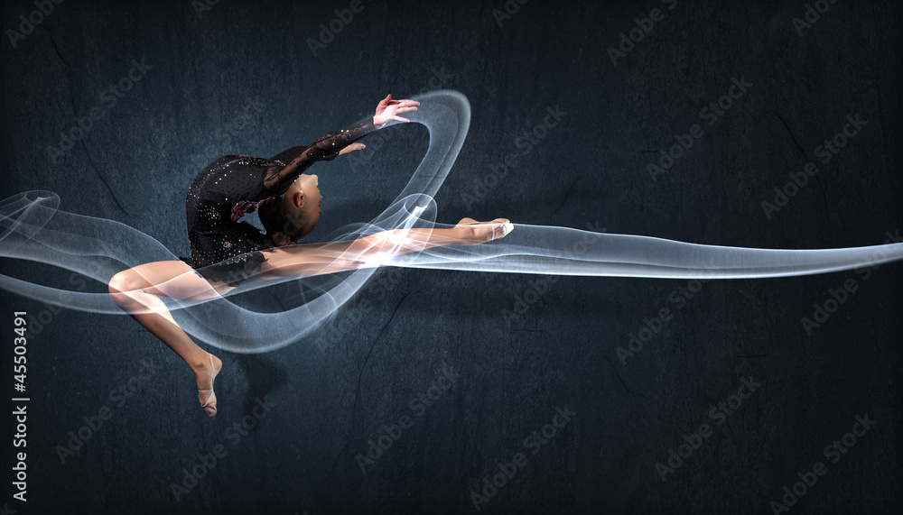 Naklejka premium Young woman in gymnast suit posing