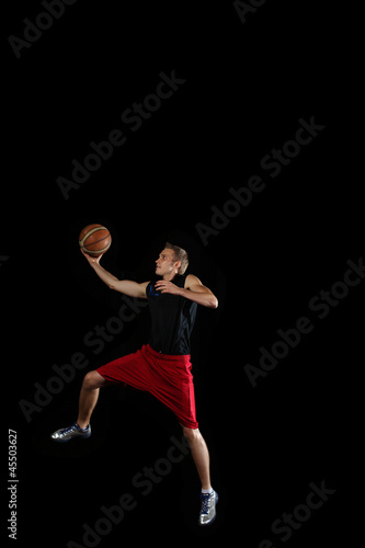 Basketball player with a ball © Sergey Nivens