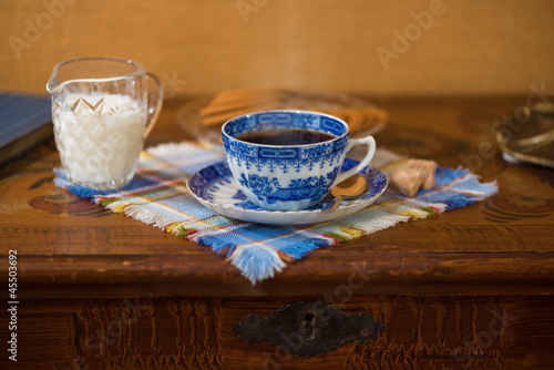 Blue coffee cup on a wooden...