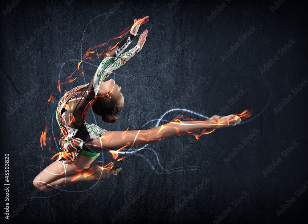 Obraz premium Young woman in gymnast suit posing