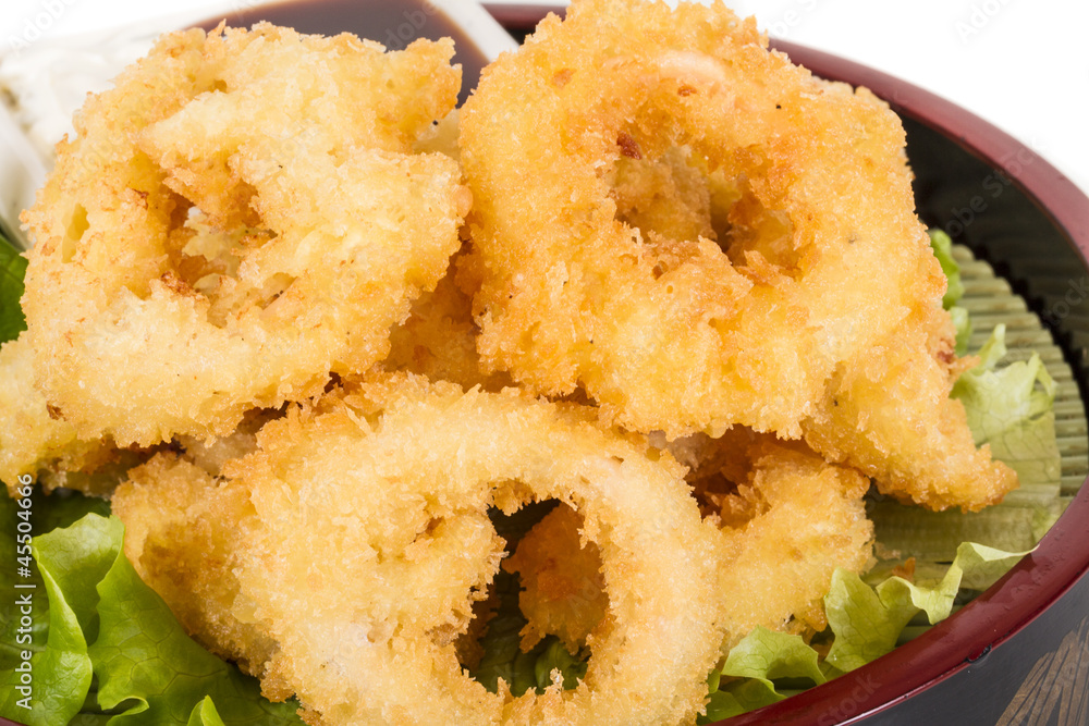 Deep batter fried squid rings calamari with green salad Deep batter fried squid rings calamari with green salad