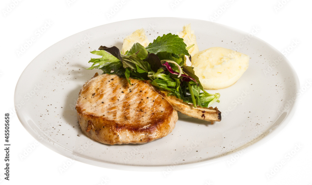 Grilled pork with salad and potato Grilled pork with salad and potato