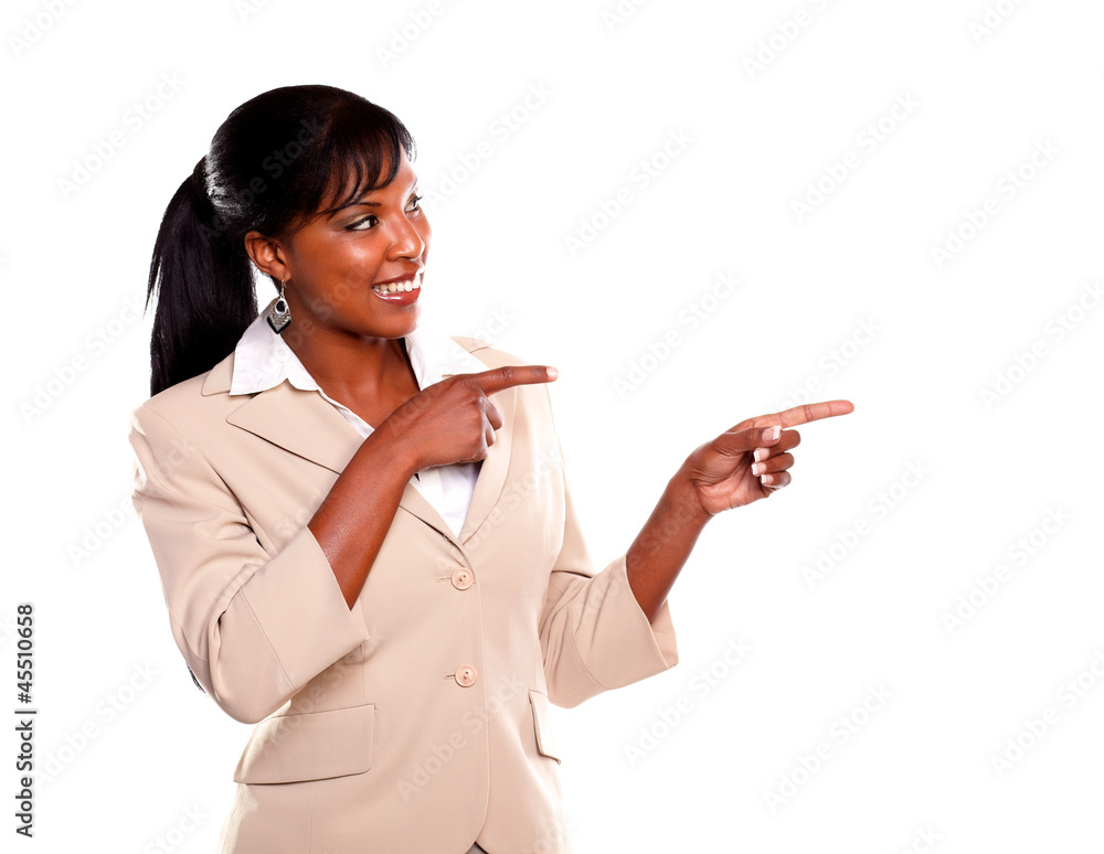 Charming young businesswoman pointing left Charming young businesswoman pointing left