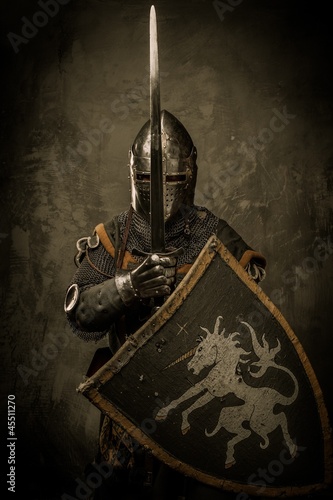 Fotografiet Medieval knight on grey background