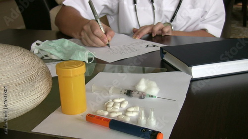 Female doctor writing prescription. photo