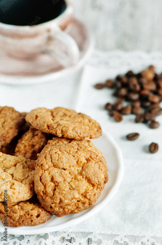 Cookies, cup of coffee and coffee beans Cookies, cup of coffee and coffee beans