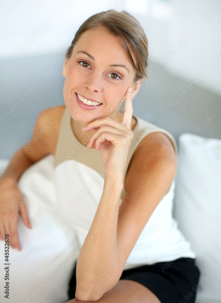 Attractive woman with hand on chin looking at camera Attractive woman with hand on chin looking at camera