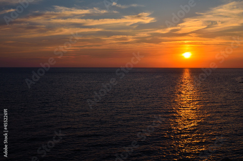 Sunset over ocean © Rinitka