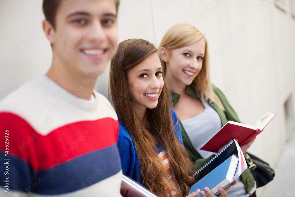 Students holding books