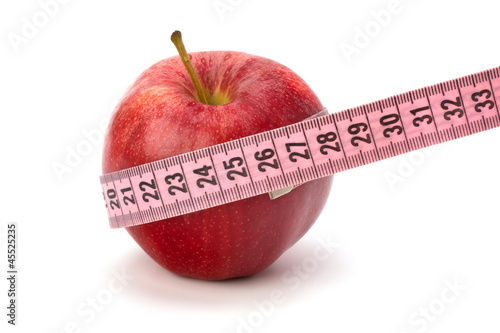 Apple with tape measure. Healthy lifestyle concept.
